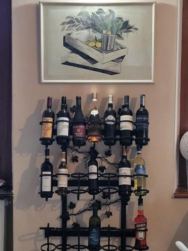 a bunch of bottles of wine on a wall at BB60 in Asti