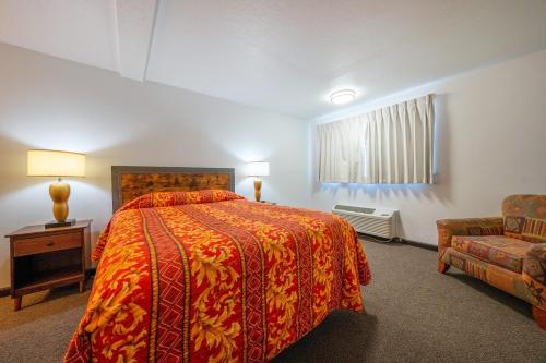 Postel nebo postele na pokoji v ubytování Unicorn Inn by OYO Portland