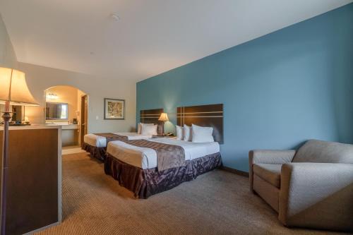 Ένα ή περισσότερα κρεβάτια σε δωμάτιο στο Moulton Inn & Suites By OYO Near Shiner TX