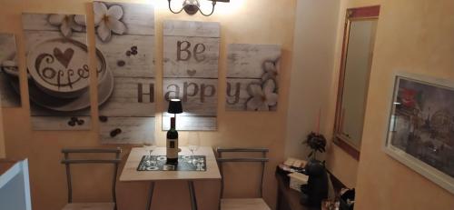 a room with a table and a wall with graffiti at B&B Golfo Asinara Suite & Relax in Sorso