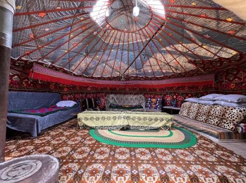 Ένα ή περισσότερα κρεβάτια σε δωμάτιο στο Bakytzhan hotel