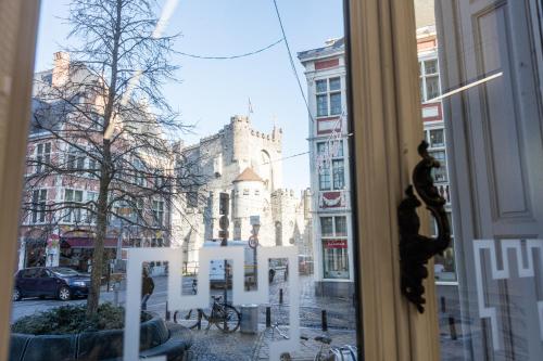 a view of a building from a window at Hotel Gravensteen in Ghent