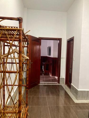 a hallway with wooden doors and a stair case at Lotus Haven Villa in Siem Reap