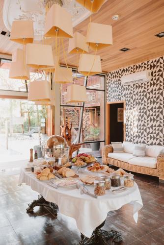 a table with food on it in a room at Puerto Dijama Hotel Boutique in Carmelo