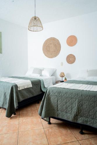 Ένα ή περισσότερα κρεβάτια σε δωμάτιο στο Central Hostel Pondicherry