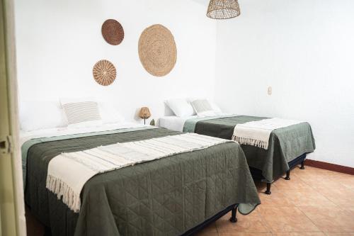 Ένα ή περισσότερα κρεβάτια σε δωμάτιο στο Central Hostel Pondicherry