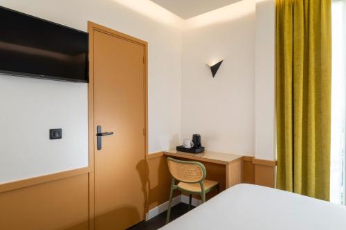 Кровать или кровати в номере Hôtel WYLD Saint Germain