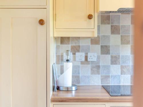 a kitchen counter with a blender on top of it at Swallow's Nest in Craven Arms