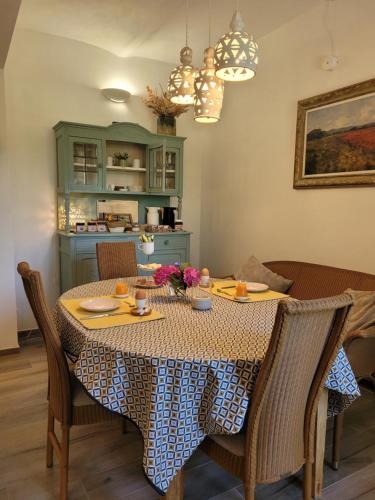 a dining room with a table and chairs at BB60 in Asti