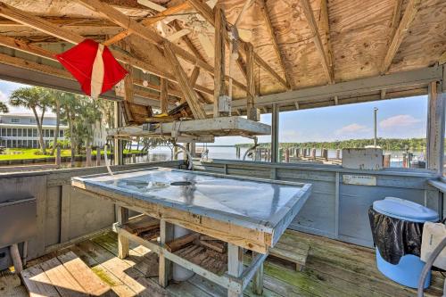 a large table in a kitchen with a large window at St Johns River Retreat in Welaka with Dock Access in Welaka