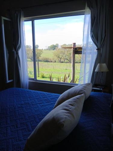 Postel nebo postele na pokoji v ubytování Cabaña La Retama