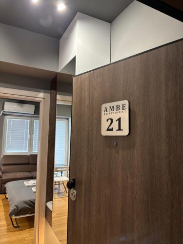 a door in a room with a sign on it at Ambe Apartments in Bitola
