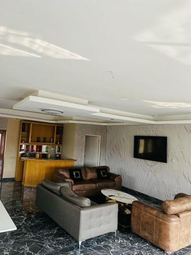 a living room with a couch and a table at National Lodge in Benoni