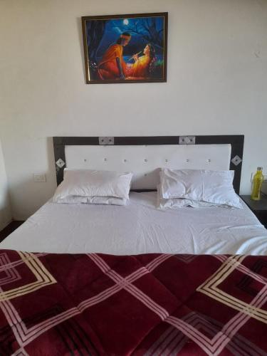 Cama o camas de una habitación en Hotel Ved Bageshwari