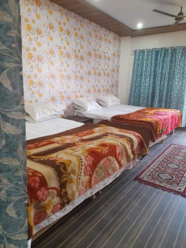 Cama o camas de una habitación en Hotel Ved Bageshwari