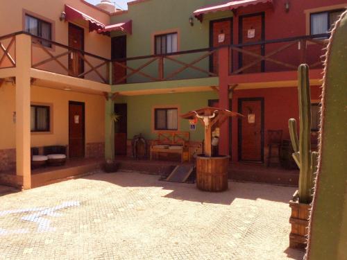 a house with a large courtyard with a cactus at West Refugio in San Juan del Río