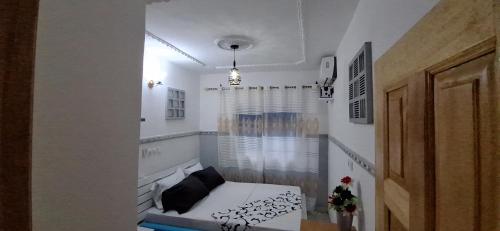 Ein Bett oder Betten in einem Zimmer der Unterkunft RÉSIDENCE VGP LOGPOM