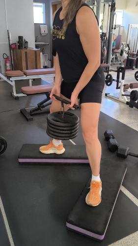a woman standing on a treadmill in a gym at Spa Belo Quinto Prime in Brotas