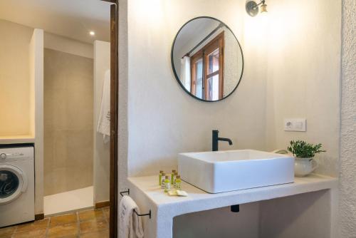 a bathroom with a white sink and a mirror at Casa Joan de Fontsagrada in Fontsagrada