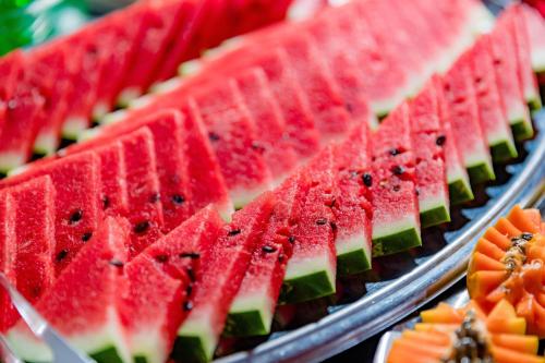a bunch of watermelon slices on a tray at Hotel Casa Blanca Porto Seguro in Porto Seguro