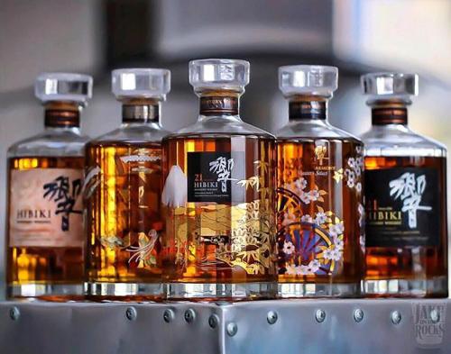 a group of four bottles of whisky on a shelf at InterContinental Halong Bay Resort by IHG in Ha Long
