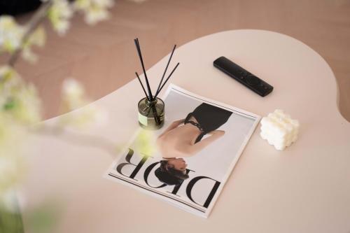 a table with a picture of a woman on it at Molly Homestay - Nanjing East Road the Bund 3-Bedroom with Elevator Apartment in Shanghai