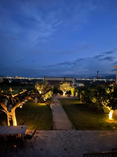 a view of a park at night at Agrivilla Mycenae Escape in Monastirákion