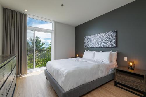 Postel nebo postele na pokoji v ubytování Les Appartements du Massif de Charlevoix