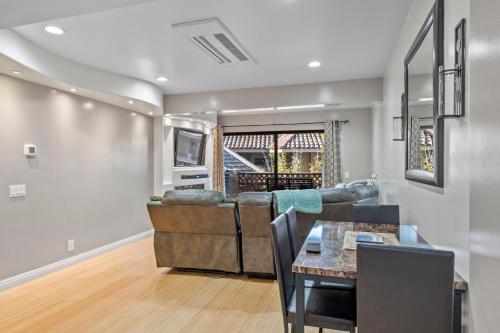 a living room with a couch and a table at Bahia Vista C53 in Avalon