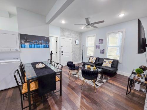 a living room with a couch and a table at Modern 2BR Apartment Near New York City in Jersey City