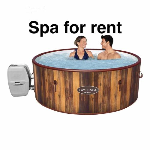 a couple in a hot tub with a spa for rent at Leiligheten in Fyresdal