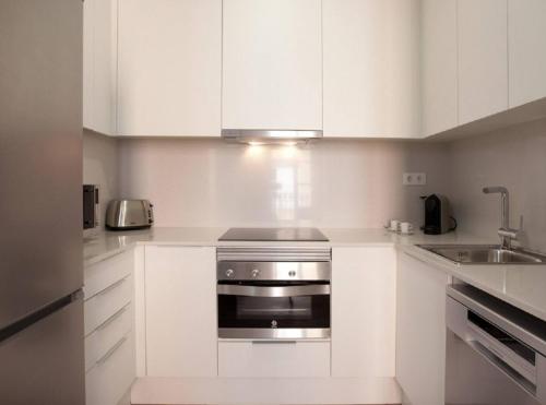 Kuchyň nebo kuchyňský kout v ubytování APBCN Eixample Center