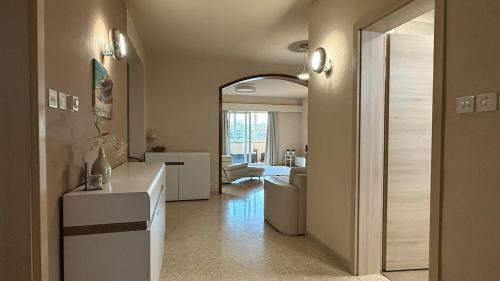 a room with a living room and a hallway at Flat in St Julians sea view in St Julian's