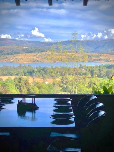 a view of a body of water from a house at Tapalpa Country Club Hotel in Tapalpa