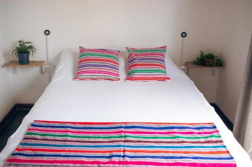 Postel nebo postele na pokoji v ubytování Temazcal Hostel