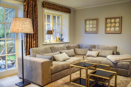 a living room with a couch and a table at Haus Lang Libben in Archsum