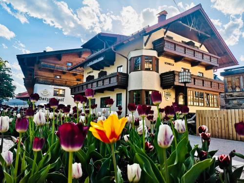 a group of tulips in front of a building at Chalet Sonneck - Seefeld in Seefeld in Tirol