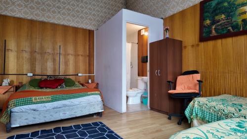 Ένα ή περισσότερα κρεβάτια σε δωμάτιο στο BVC Hotel Iquique Cavancha