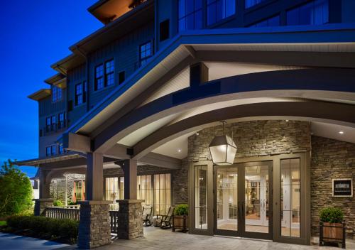 a blue building with glass doors in front at The Inn at Chesapeake Bay Beach Club in Stevensville