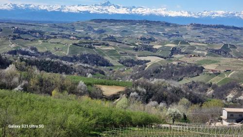 a view of a valley with snow covered mountains at Albergo Trieste Boves - Ricetto Suite in Boves
