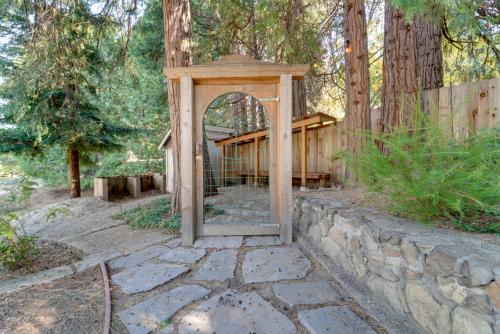 a gazebo with a gate in a garden at Near Dtwn and Pioneer Park Home with Furnished Patio in Nevada City