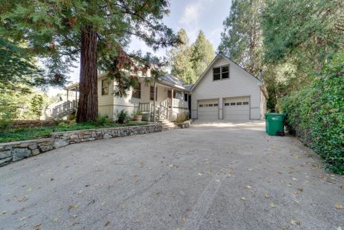 a driveway in front of a white house at Near Dtwn and Pioneer Park Home with Furnished Patio in Nevada City