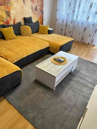 a living room with a couch and a coffee table at Marta's apartment in Shabla