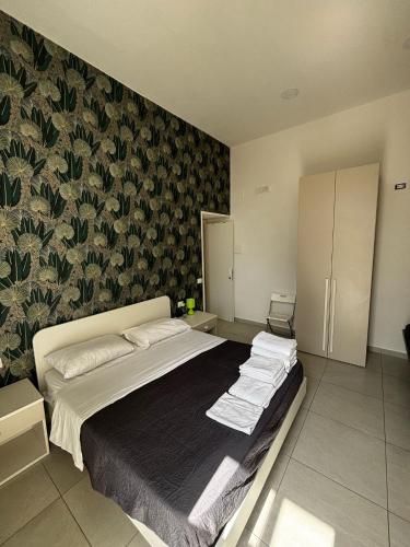 Un pat sau paturi într-o cameră la Niki Home