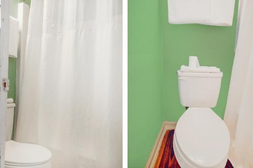two pictures of a bathroom with a toilet and a shower at OYO Inn Kernersville in Kernersville