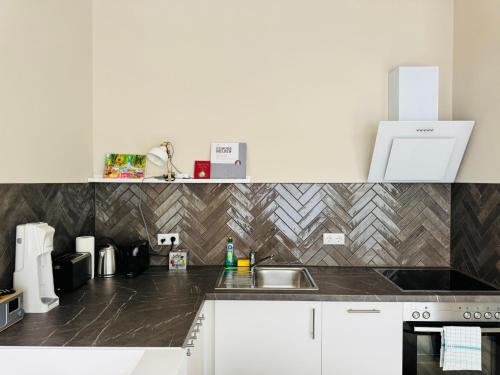Dapur atau dapur kecil di URBAN STAY Hamburg - Apartments "BACKBORD" & "STEUERBORD mit Sauna"