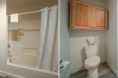 a bathroom with a toilet and a tub and a shower at City Centre Motel by OYO in Seaside