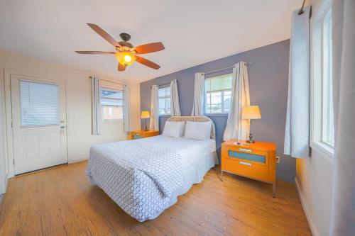 a bedroom with a bed and a ceiling fan at City Centre Motel by OYO in Seaside