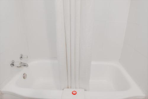 a bathroom with a shower and a sink at OYO Hotel Liberal, Kansas in Liberal