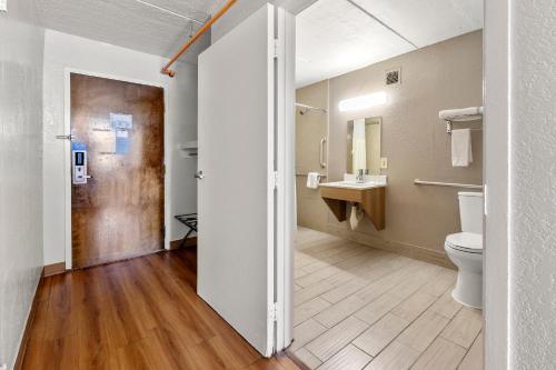 a bathroom with a toilet and a sink at Motel 6-Decatur, GA in Decatur